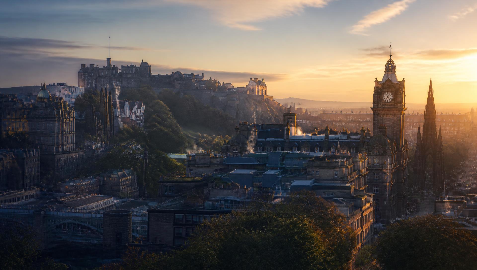 Edinburgh skyline at golden hour with the castle and Balmoral clock tower